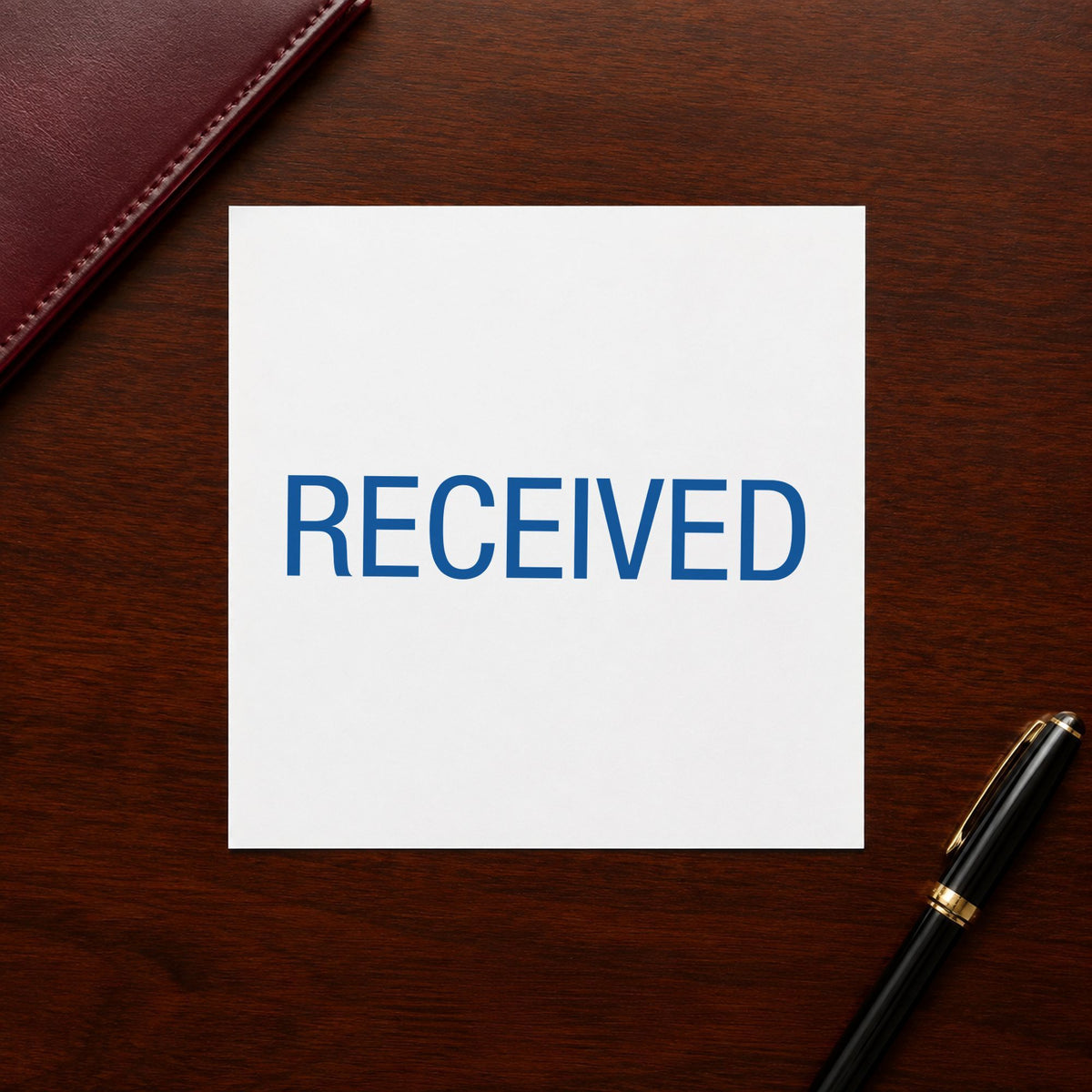 "Received" stamp pressed on paper, no separate ink pad needed
