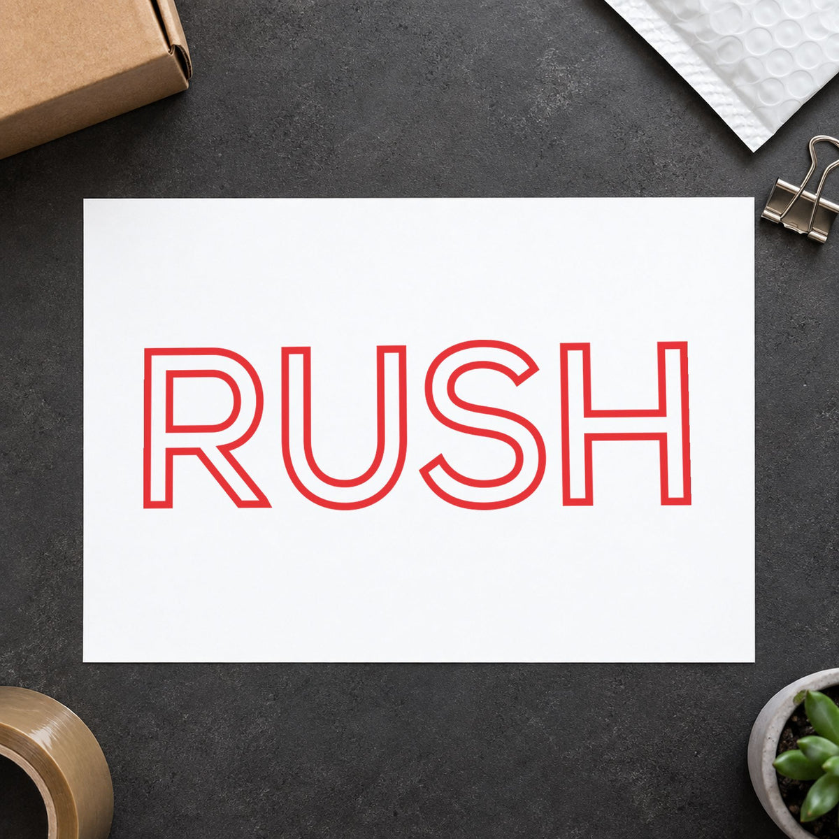 "Rush" Xstamper pre-inked stamp beside its rectangle imprint