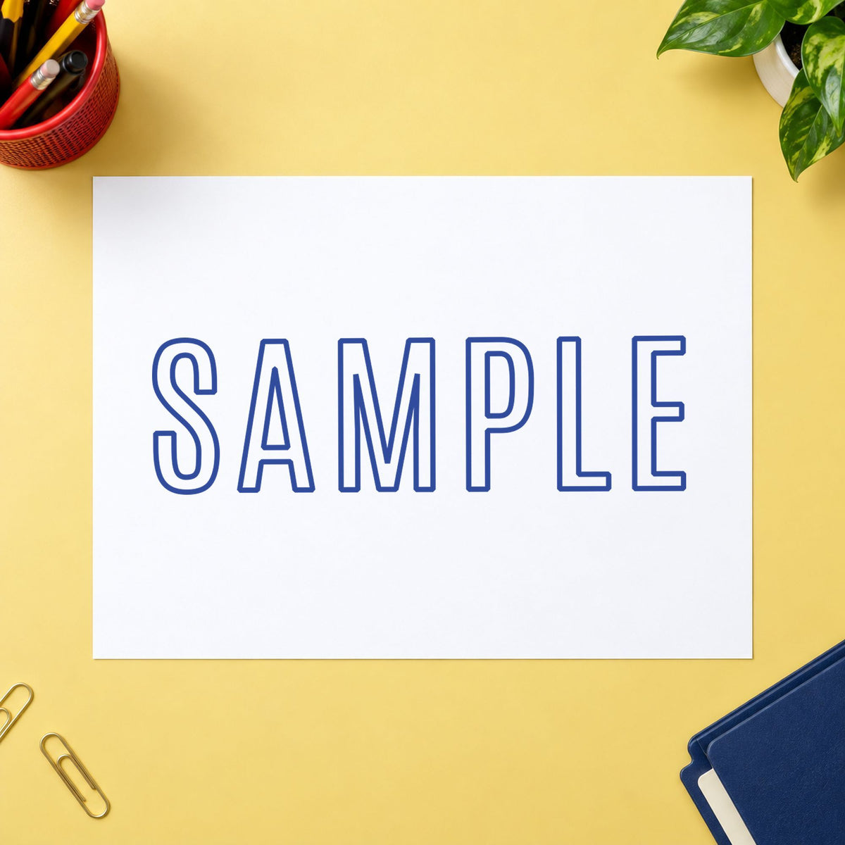 "Sample" Xstamper stamp at work on everyday office paperwork