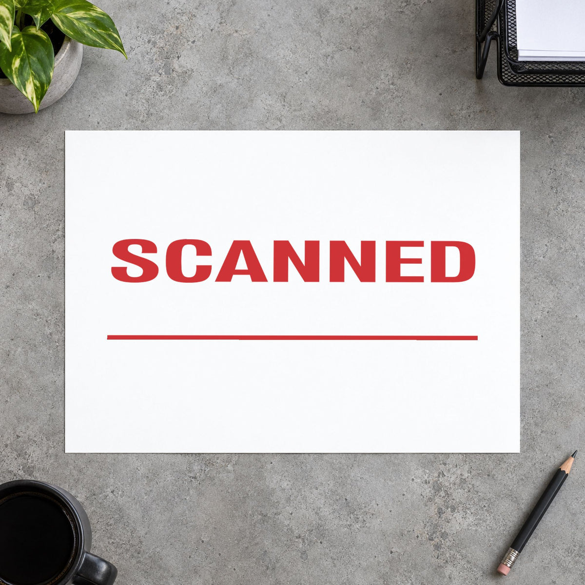 Pre-inked "Scanned" stamp marking paperwork in an office setting