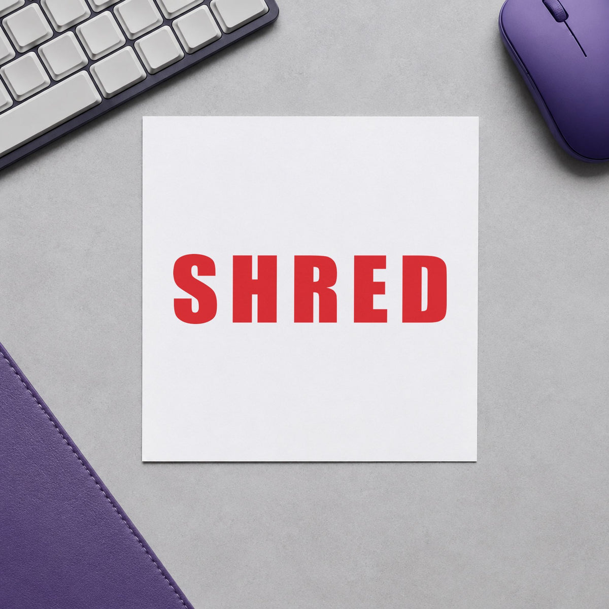 "Shred" Xstamper pre-inked stamp beside its rectangle imprint
