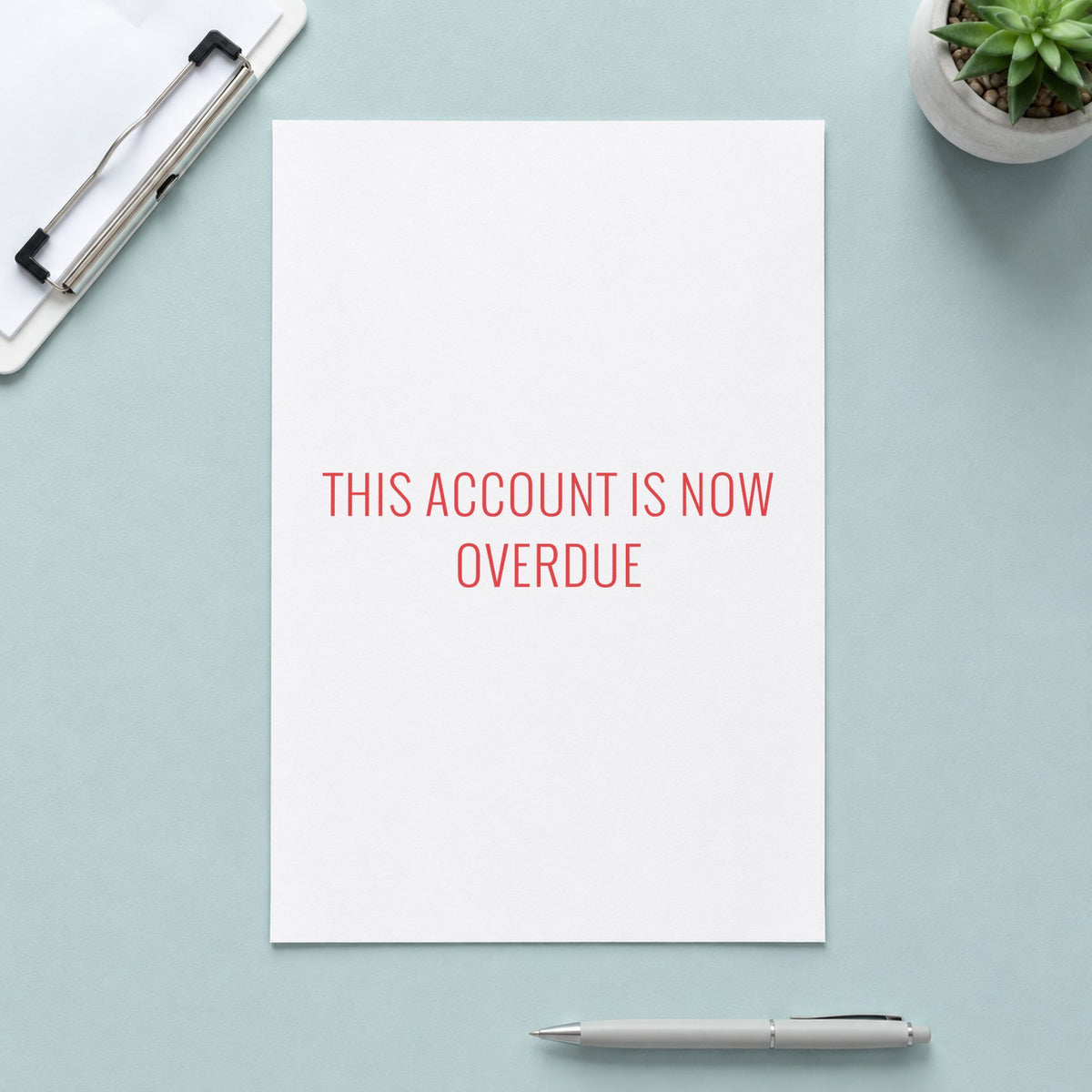 Pre-inked "This account is now overdue" stamp applied to a document, 1/2 x 1-5/8 in impression