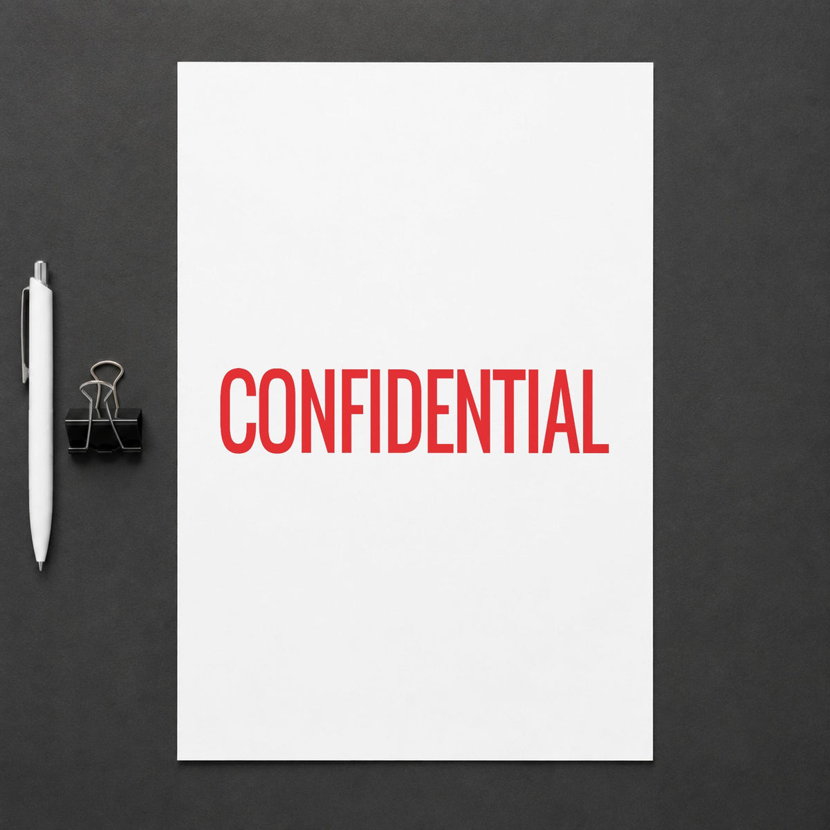 "Confidential" Xstamper pre-inked stamp beside its rectangle imprint