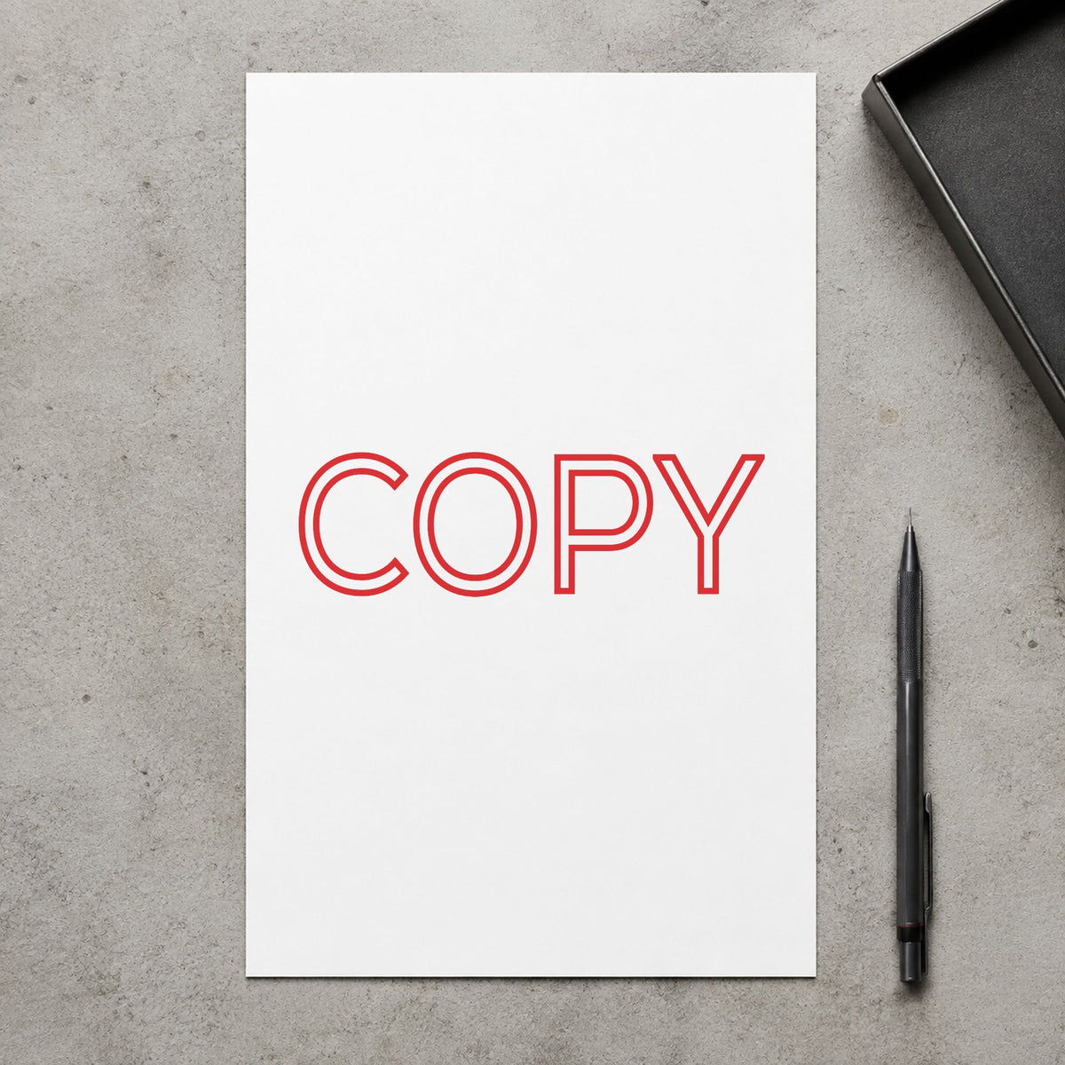 Pre-inked "Copy" stamp marking paperwork in an office setting