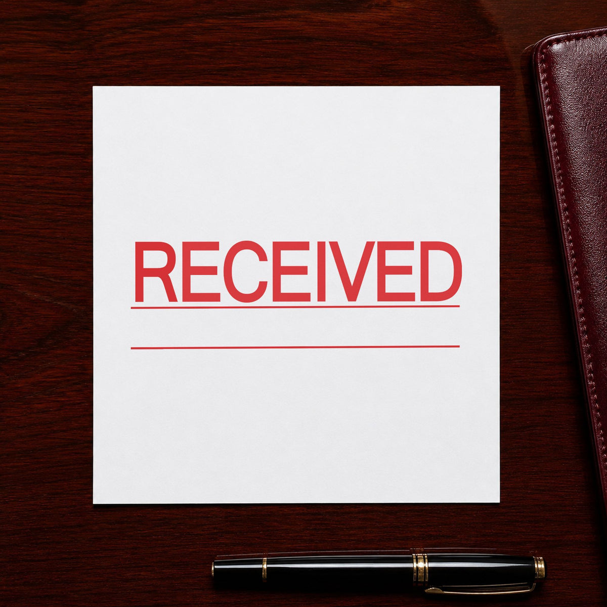 "Received" Xstamper stamp in use on paper, Approximately 7/8 in tall x 2-3/4 in wide rectangle imprint