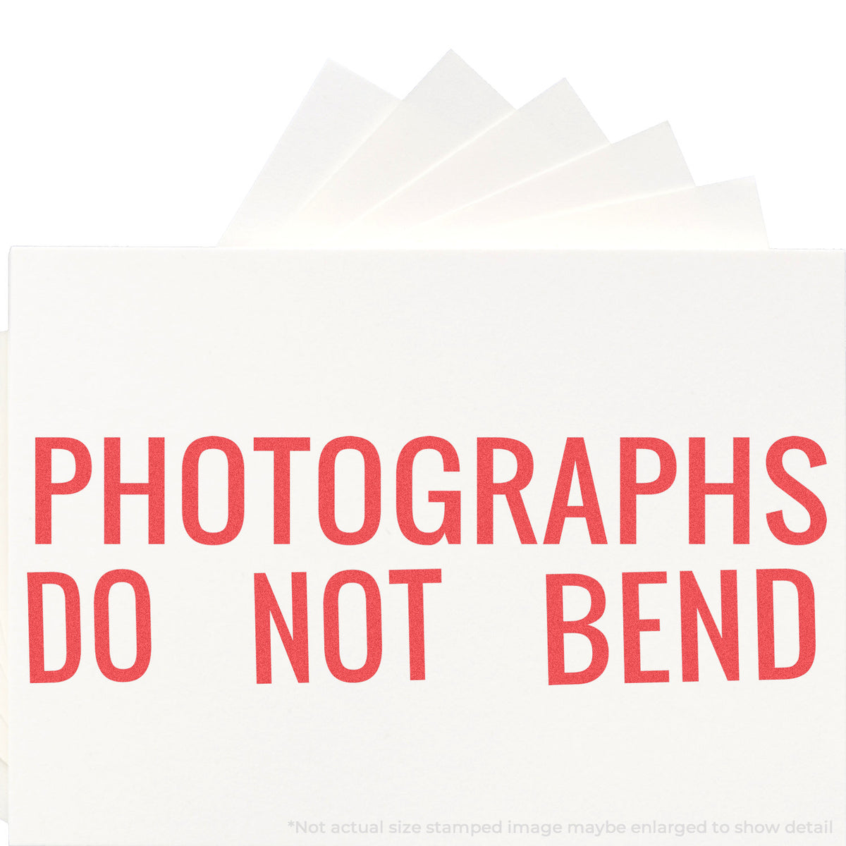 "Photographs do not bend" stamp and its crisp 7/8 x 2-3/4 in impression on paper