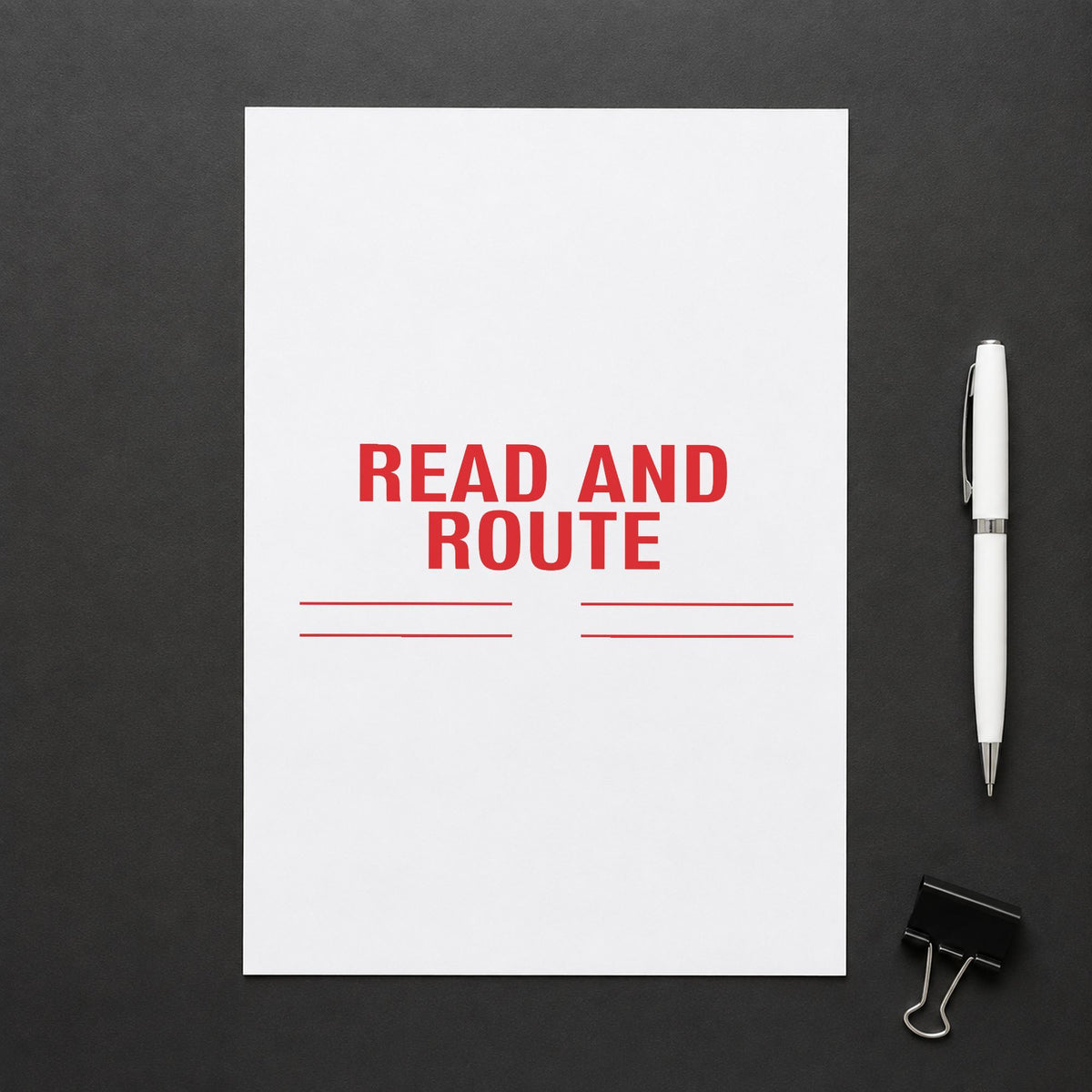 "Read and route" Xstamper stamp in use on paper, 7/8 x 2-3/4 in rectangle imprint