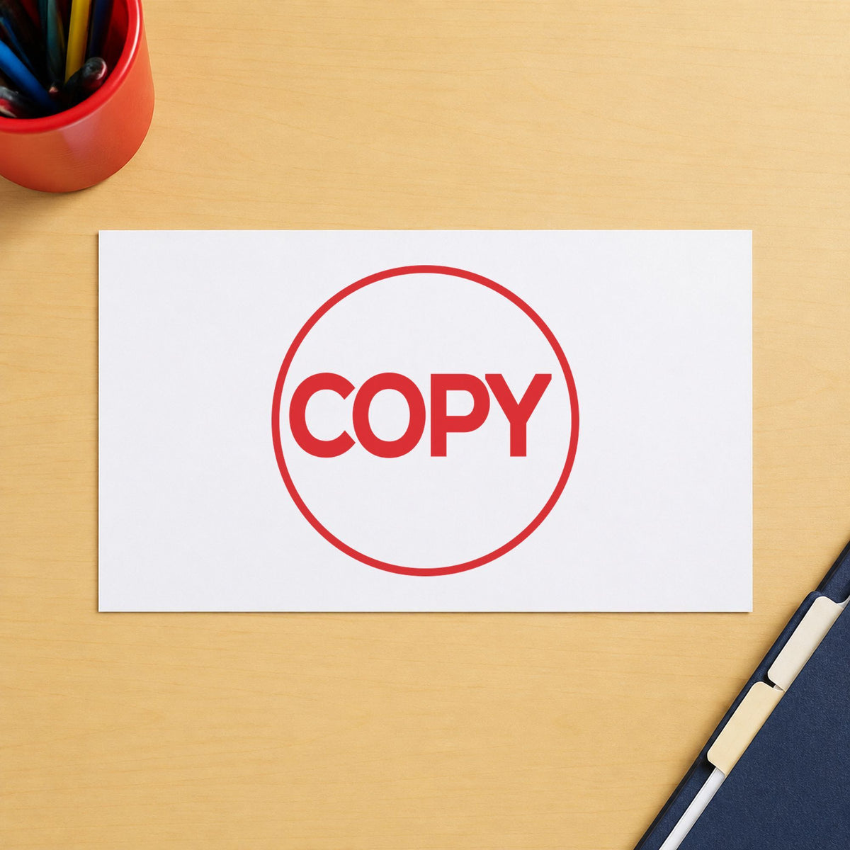 "Copy" Xstamper stamp in use on paper, Approximately 5/8 in diameter round imprint