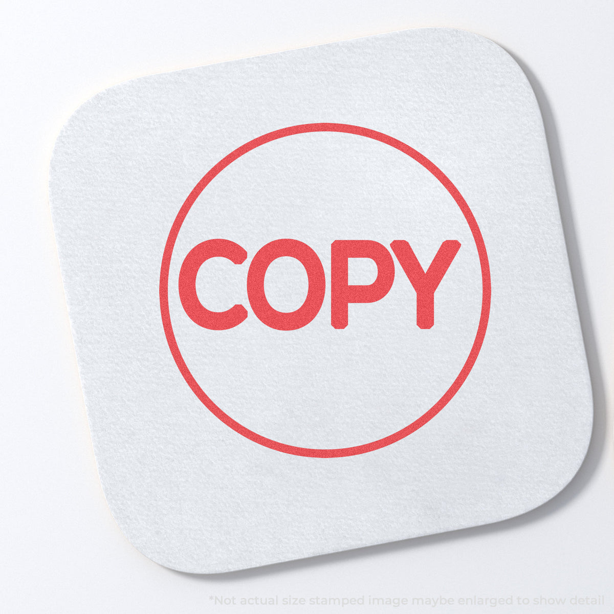 "Copy" stamp and its crisp Approximately 5/8 in diameter impression on paper
