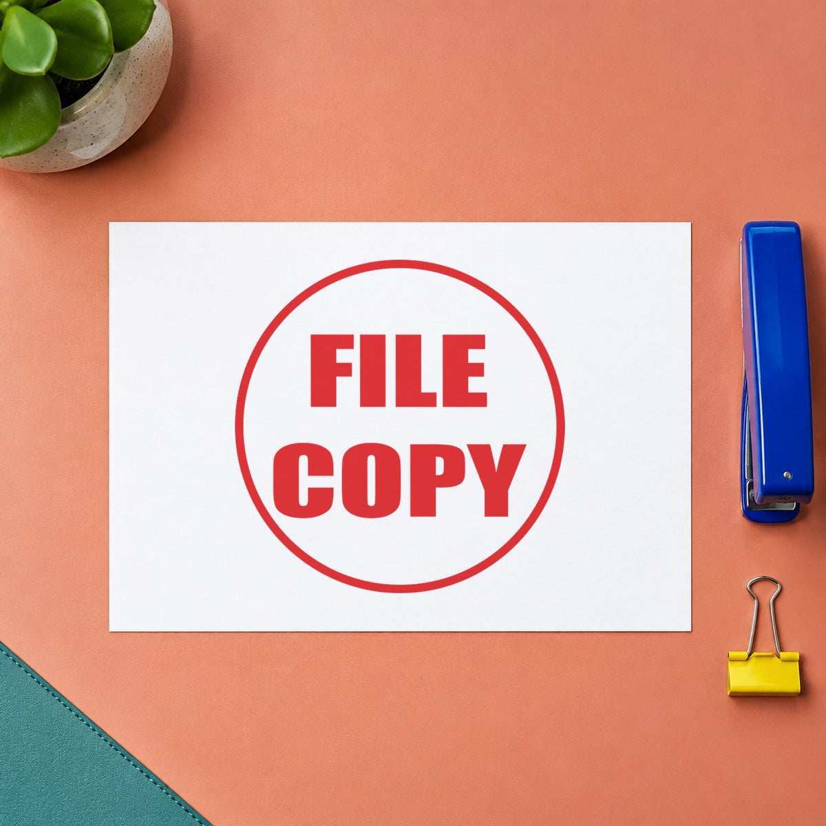 "File copy" stamp pressed on paper, no separate ink pad needed