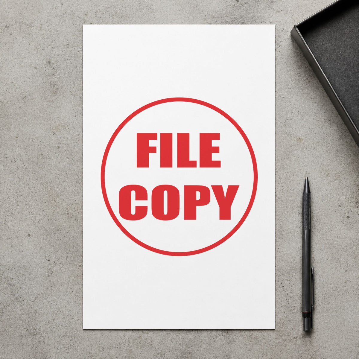 Pre-inked "File copy" stamp marking paperwork in an office setting
