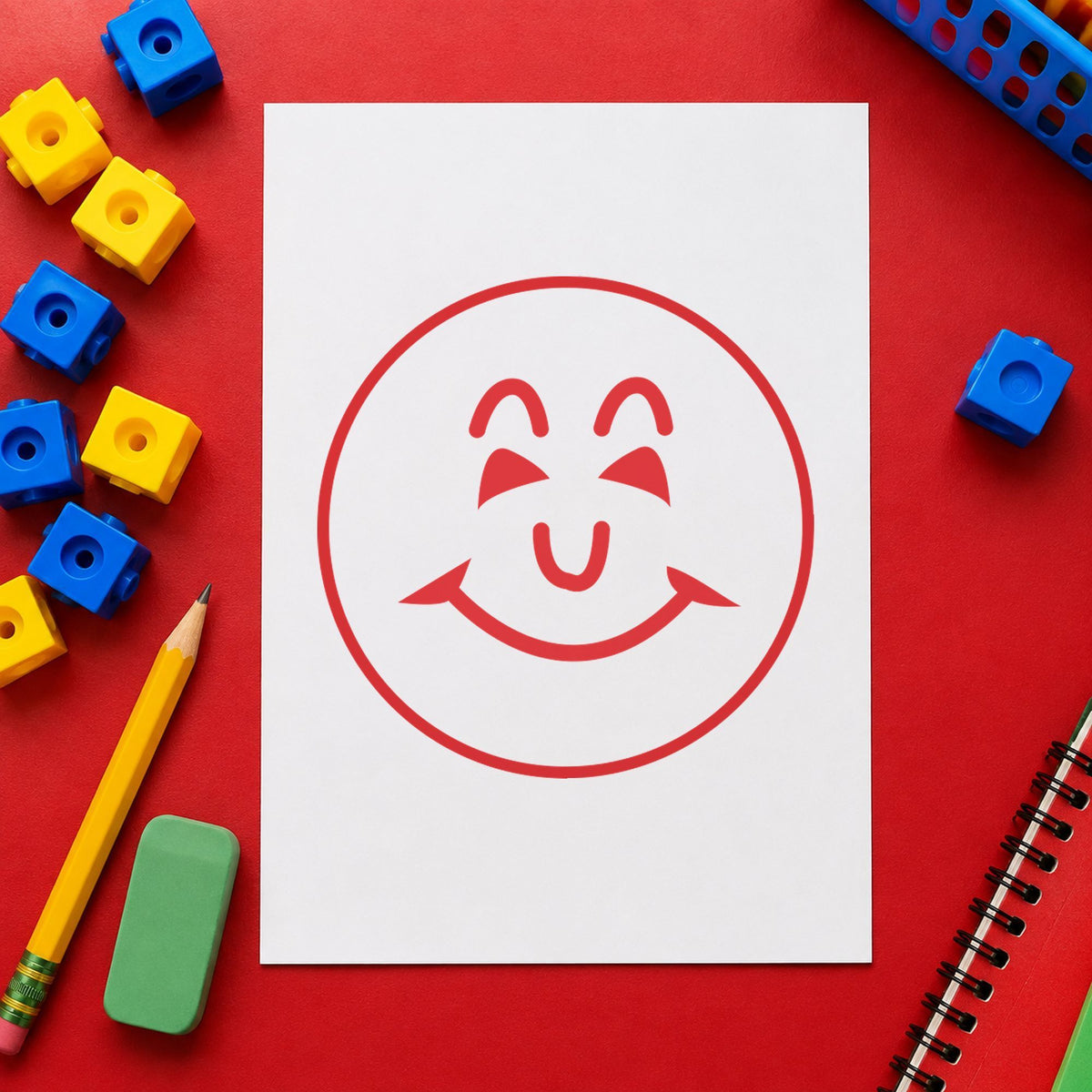 "Smiley face" Xstamper stamp in use on paper, 5/8 in diameter round imprint