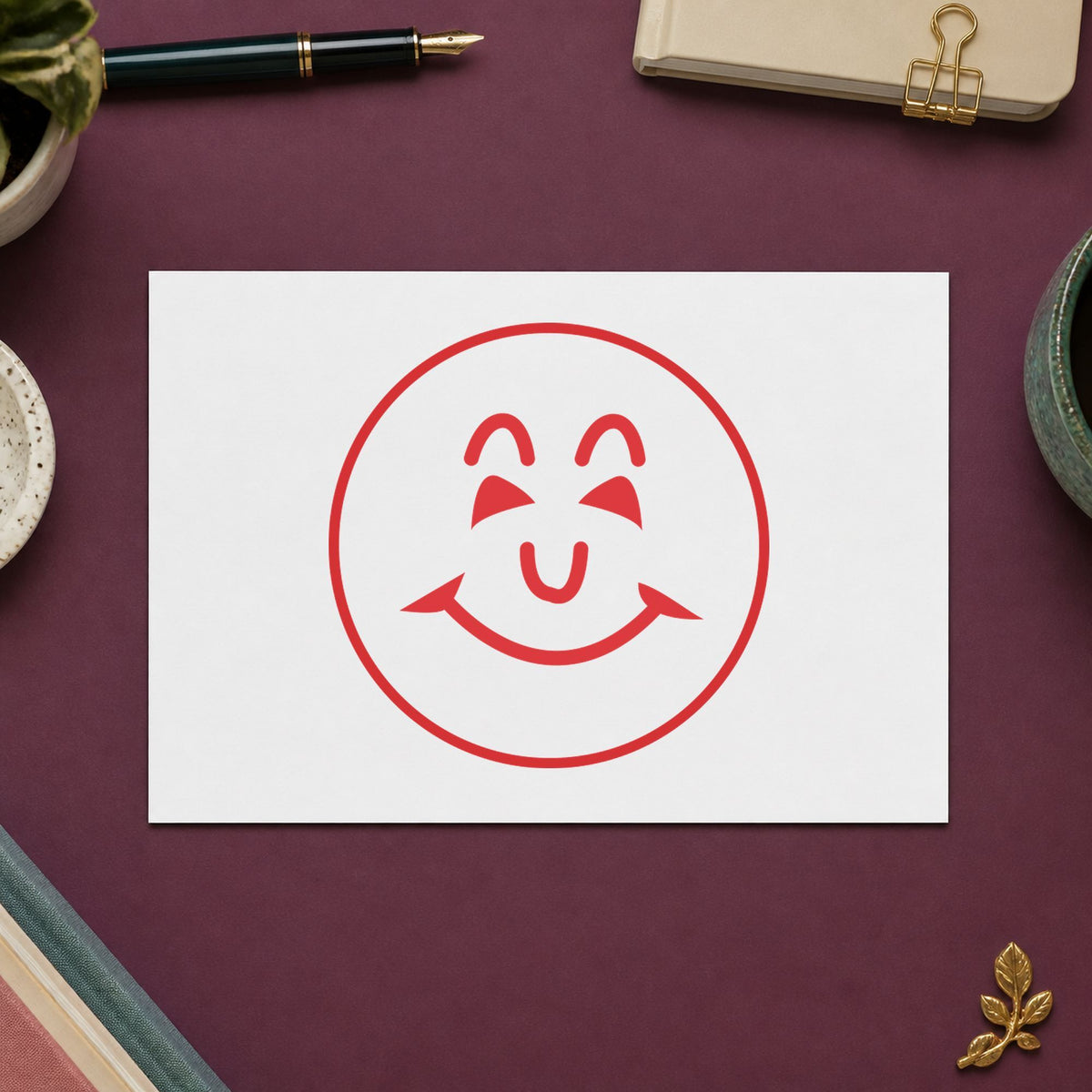 "Smiley face" Xstamper No. 11303 stamp shown in everyday handling
