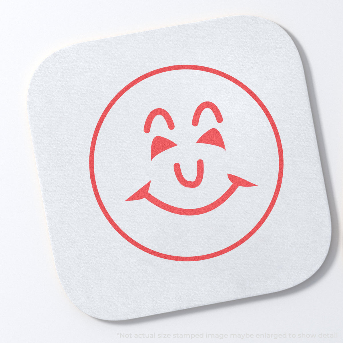 "Smiley face" stamp and its crisp 5/8 in diameter impression on paper