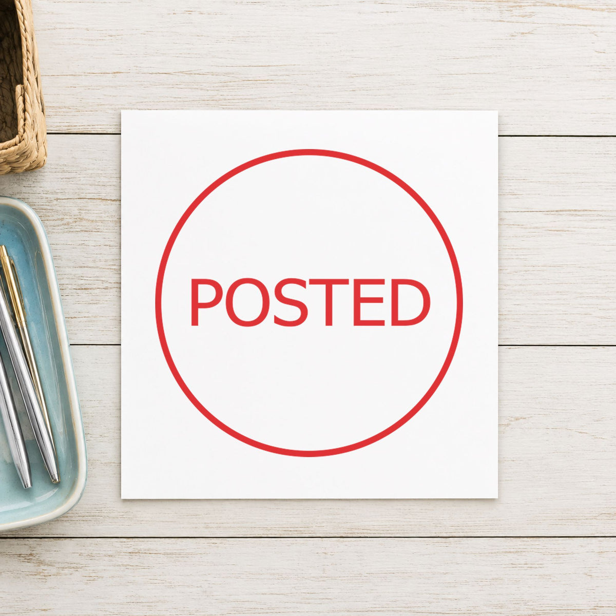 "Posted" Xstamper stamp in use on paper, Approximately 5/8 in diameter round imprint