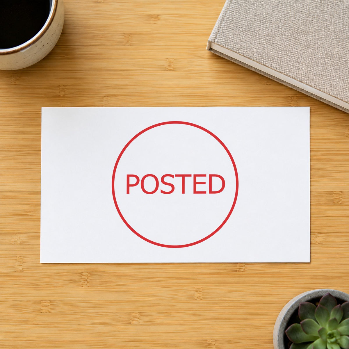Pre-inked "Posted" stamp marking paperwork in an office setting