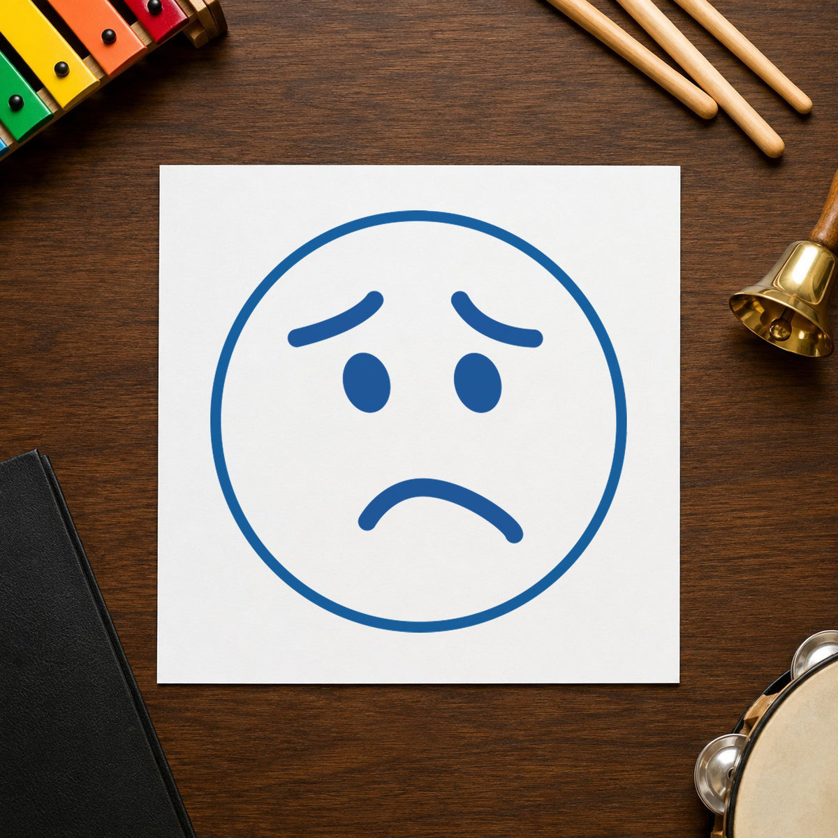 Pre-inked "Frown face" stamp applied to a document, 5/8 in diameter impression