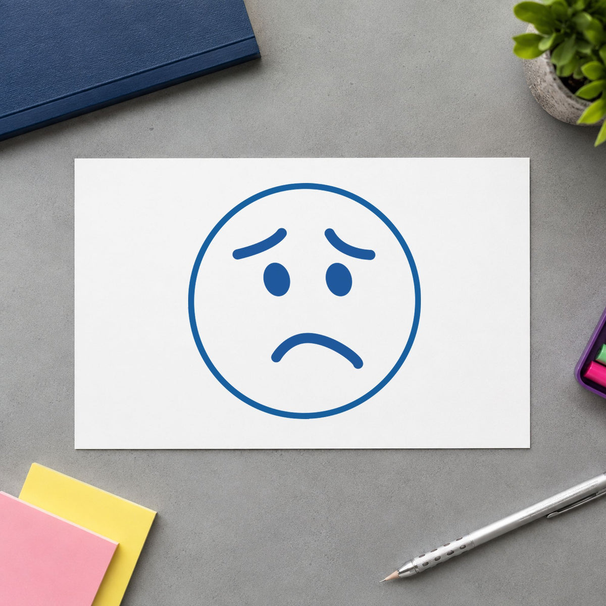 "Frown face" imprint sized 5/8 in diameter on a document page