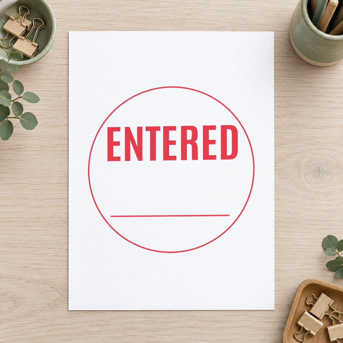 Close view of the "Entered" mark left by Xstamper No. 11418