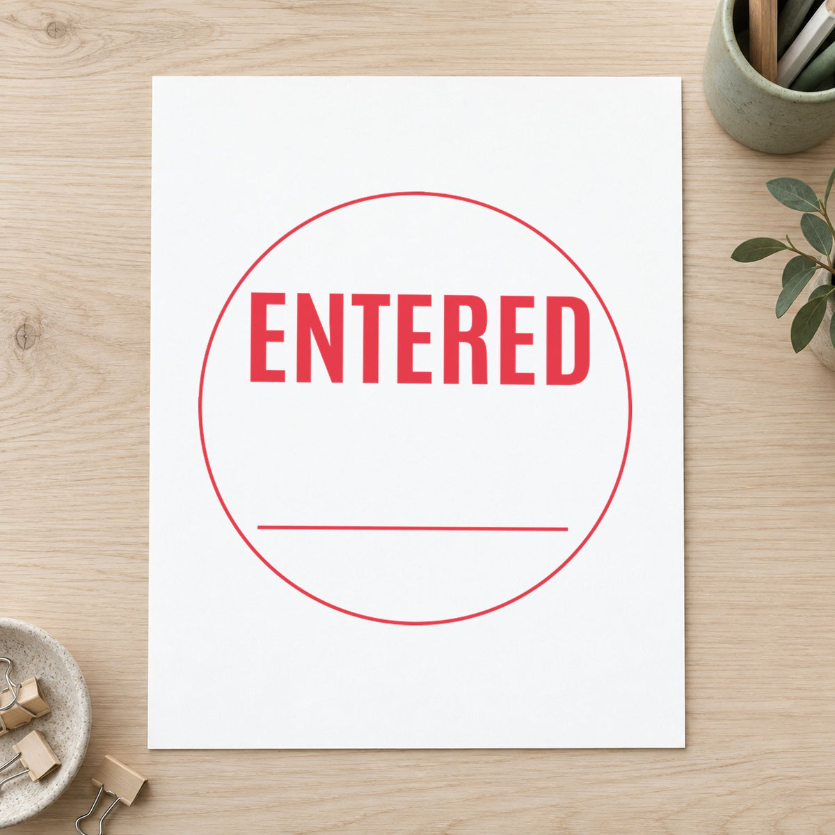 "Entered" imprint sized Approximately 5/8 in diameter on a document page