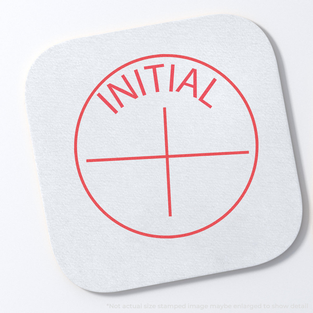 "Initial" stamp and its crisp 5/8 in diameter impression on paper