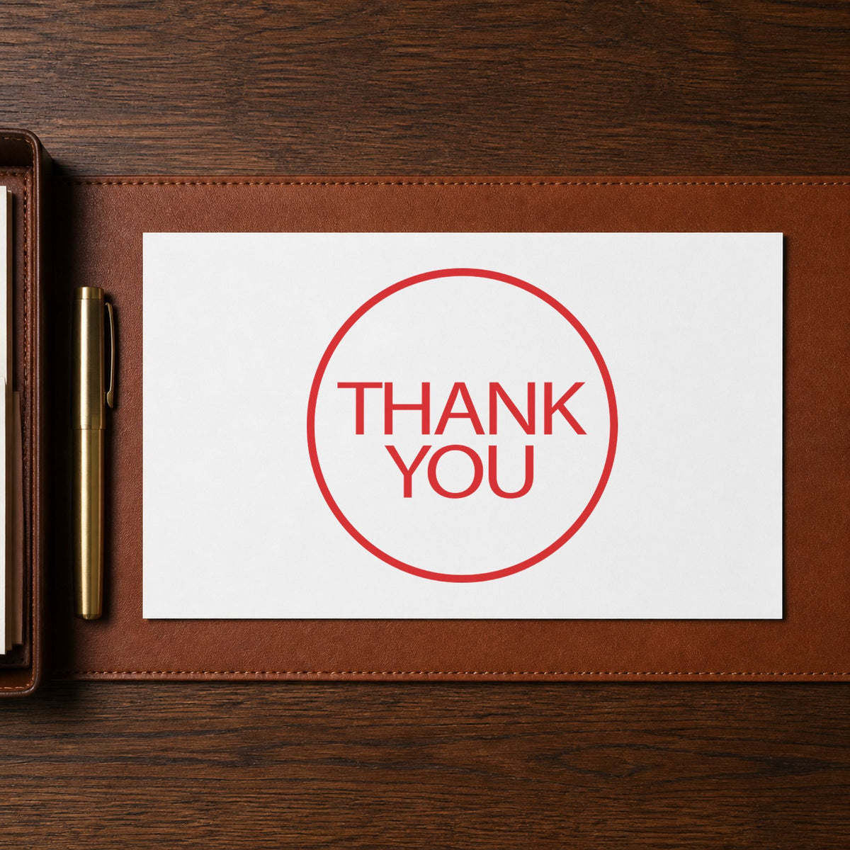 Pre-inked "Thank you" stamp marking paperwork in an office setting