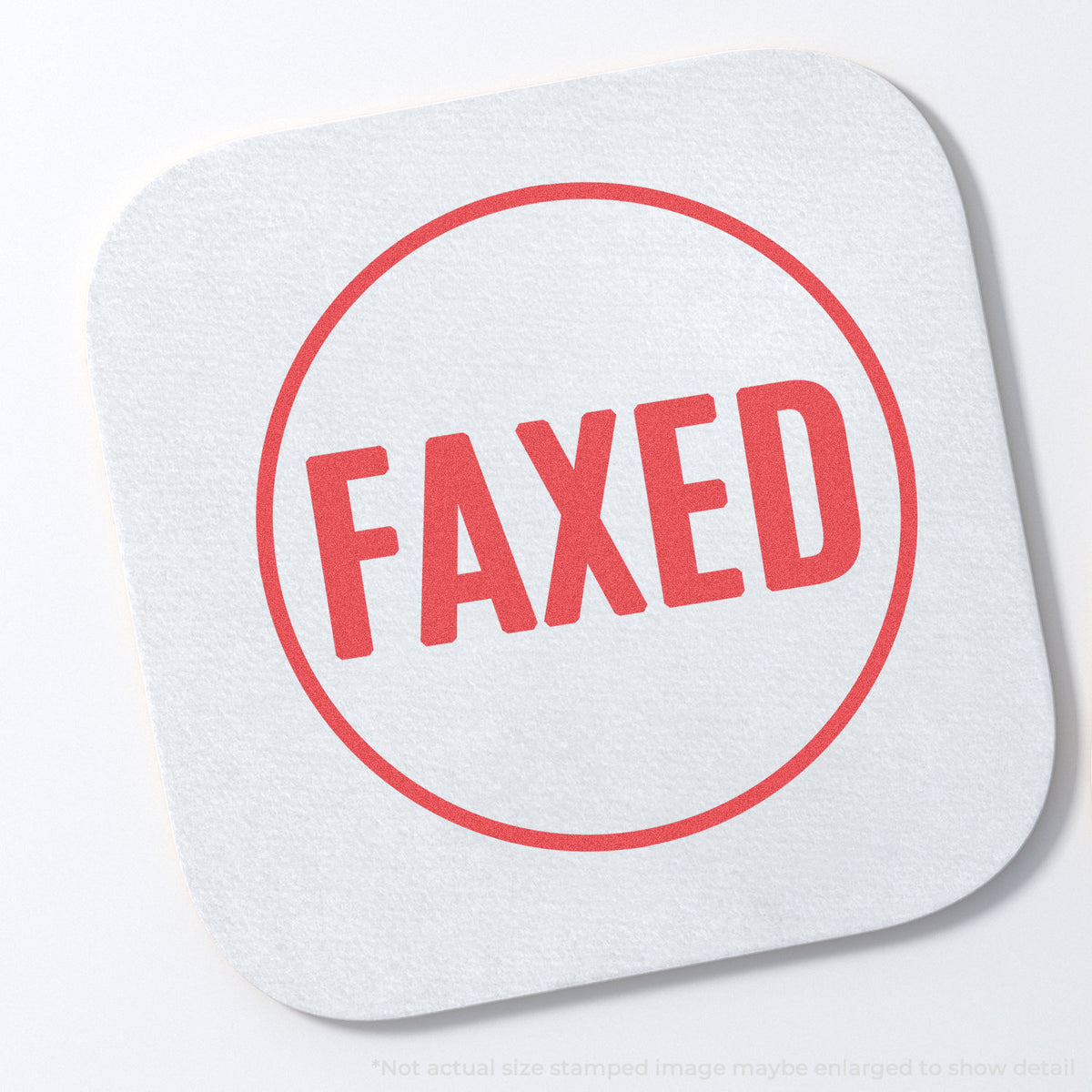 "Faxed" stamp and its crisp Approximately 5/8 in diameter impression on paper