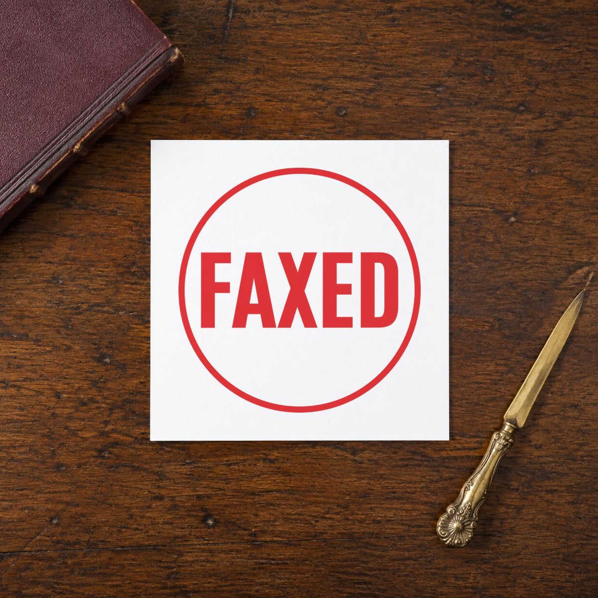 "Faxed" Xstamper pre-inked stamp beside its round imprint