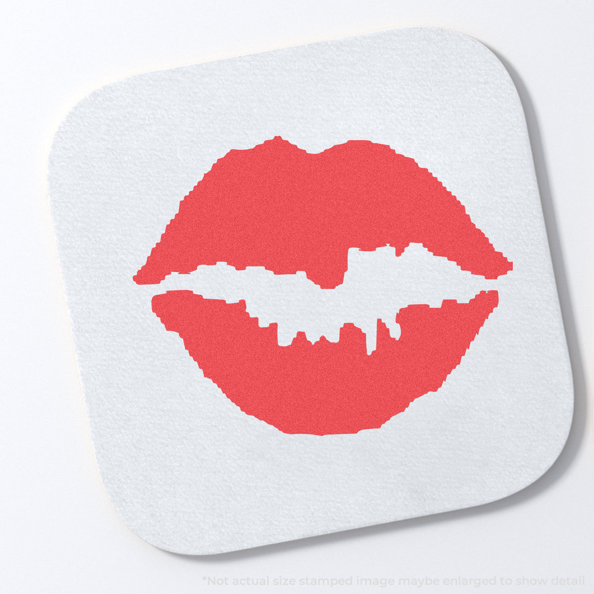 "Kiss" stamp and its crisp Approximately 5/8 in diameter impression on paper