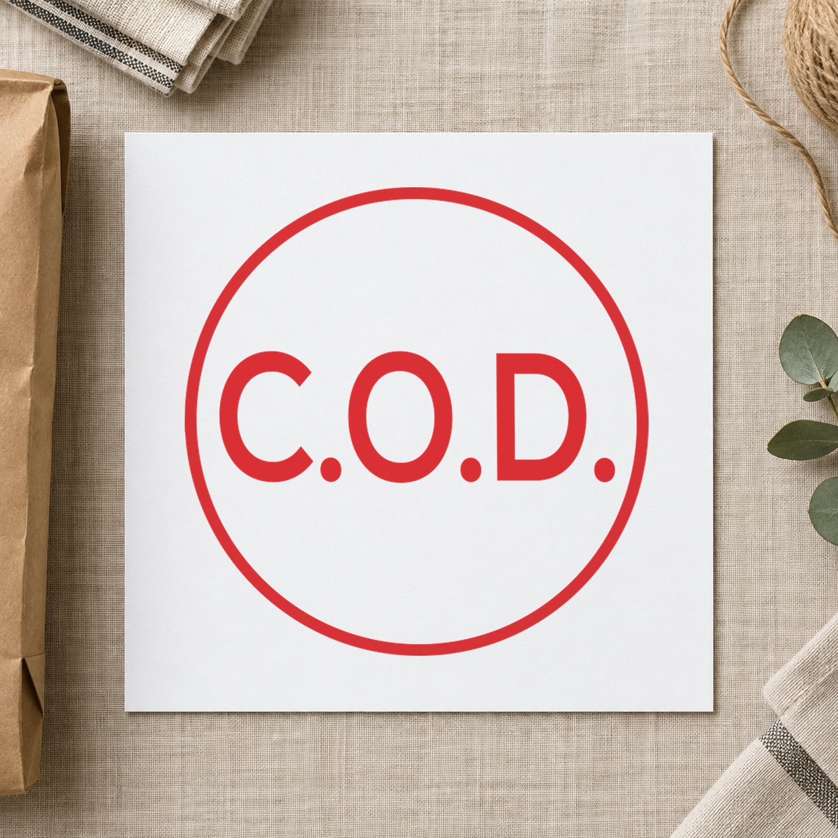 "C.O.D." Xstamper stamp in use on paper, Approximately 5/8 in diameter round imprint