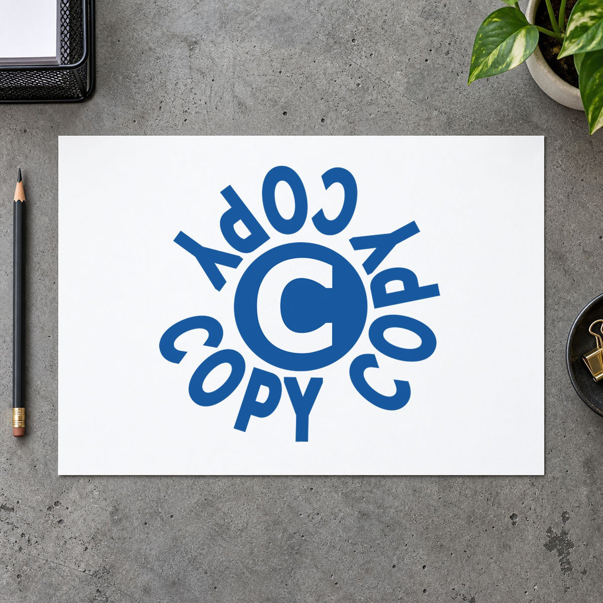 "Copy" Xstamper stamp in use on paper, 5/8 in diameter round imprint