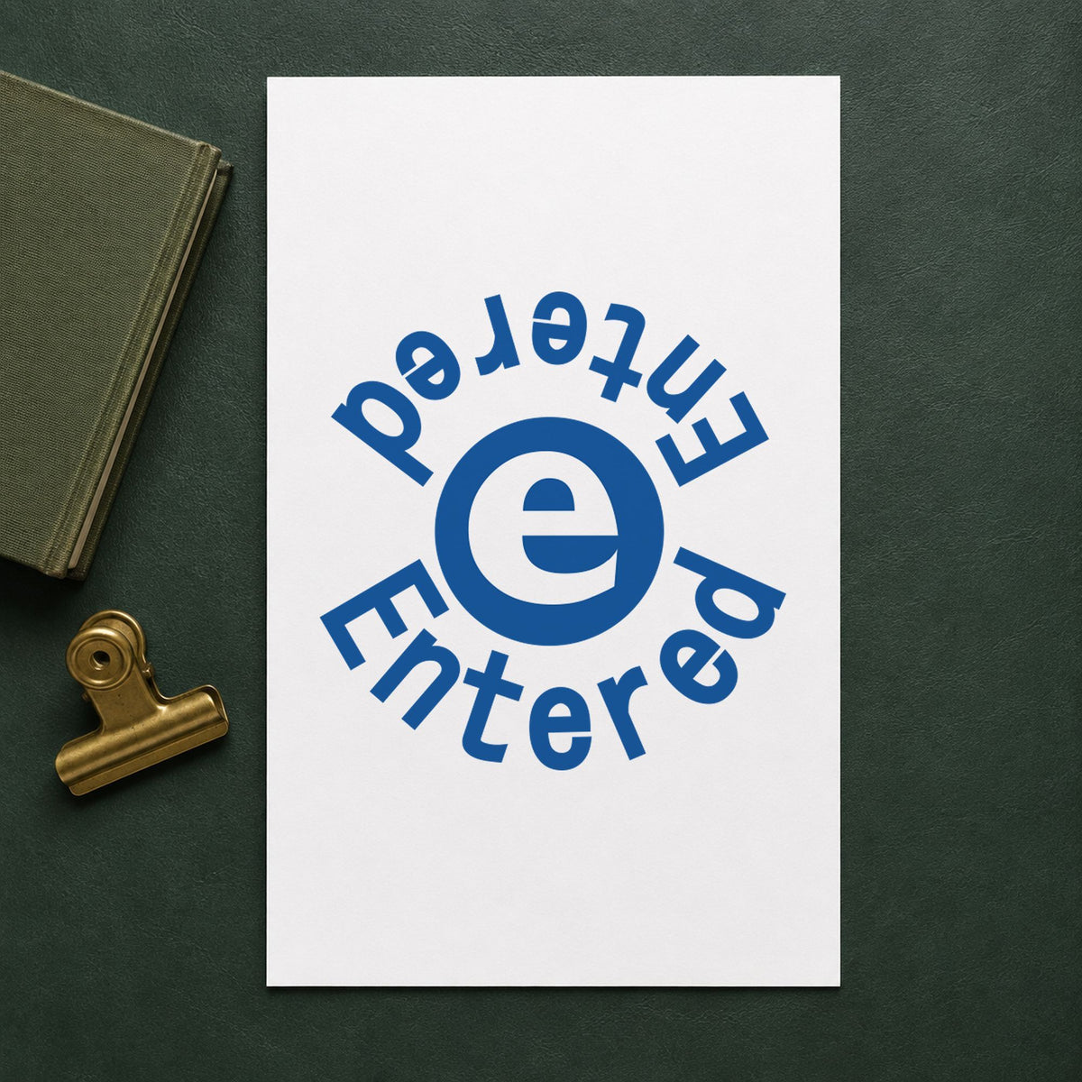 Pre-inked "Entered" stamp applied to a document, Approximately 5/8 in diameter impression