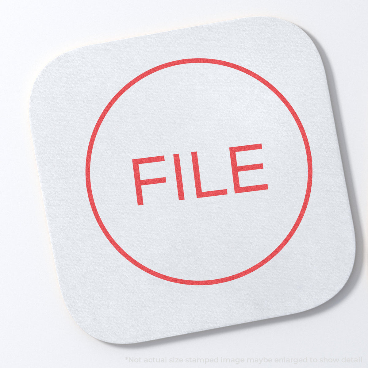 "File" stamp and its crisp 5/8 in diameter impression on paper