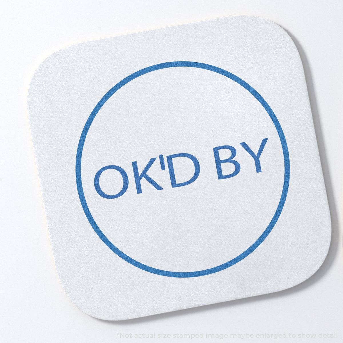 "OK'd by" stamp and its crisp 5/8 in diameter impression on paper