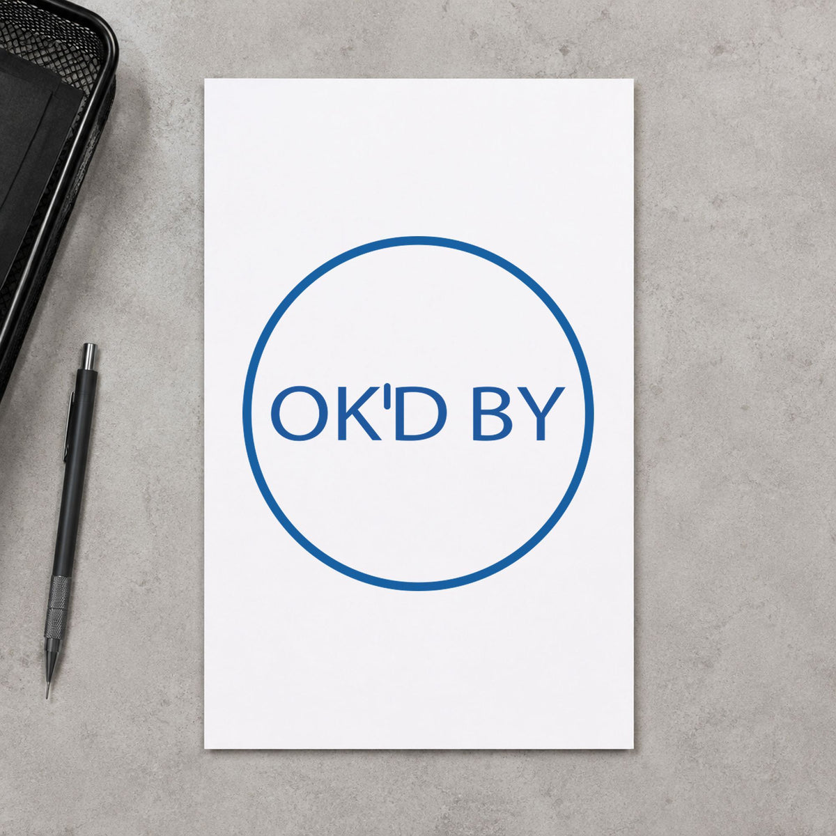 Pre-inked "OK'd by" stamp applied to a document, 5/8 in diameter impression