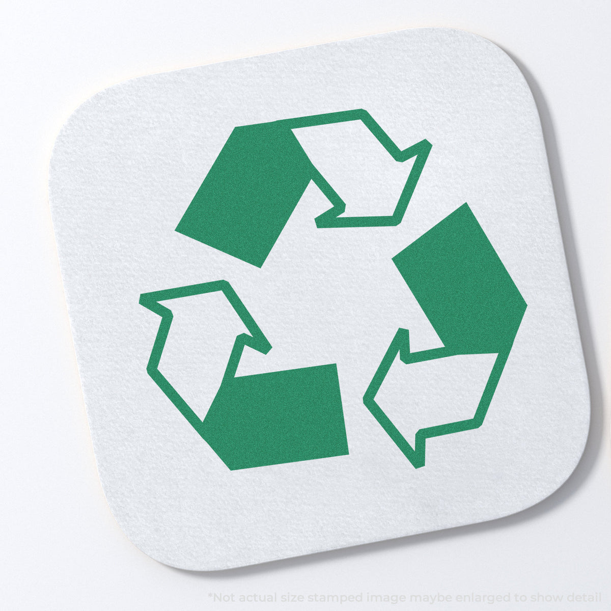 "Recycle logo" stamp and its crisp Approximately 5/8 in diameter impression on paper