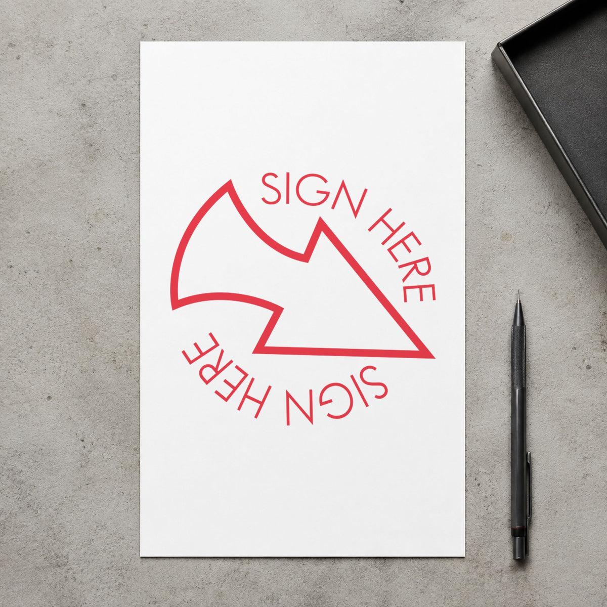 "Sign here" Xstamper stamp in use on paper, 5/8 in diameter round imprint