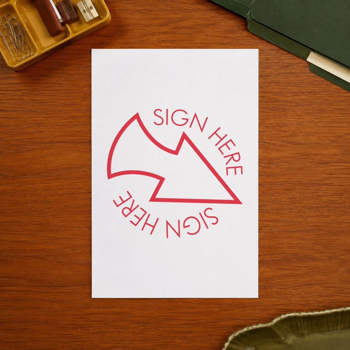 "Sign here" Xstamper stamp at work on everyday office paperwork