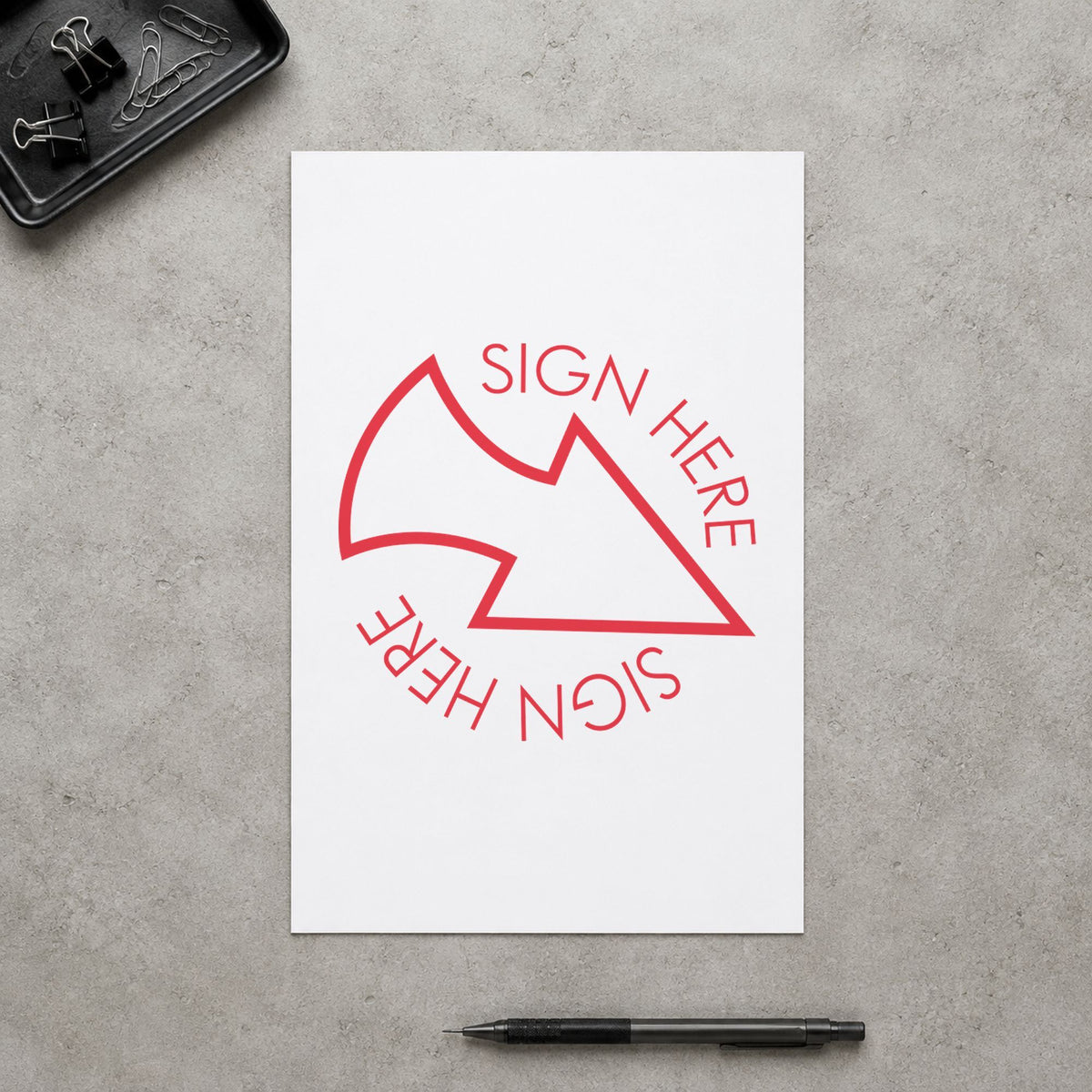 "Sign here" stamp pressed on paper, no separate ink pad needed