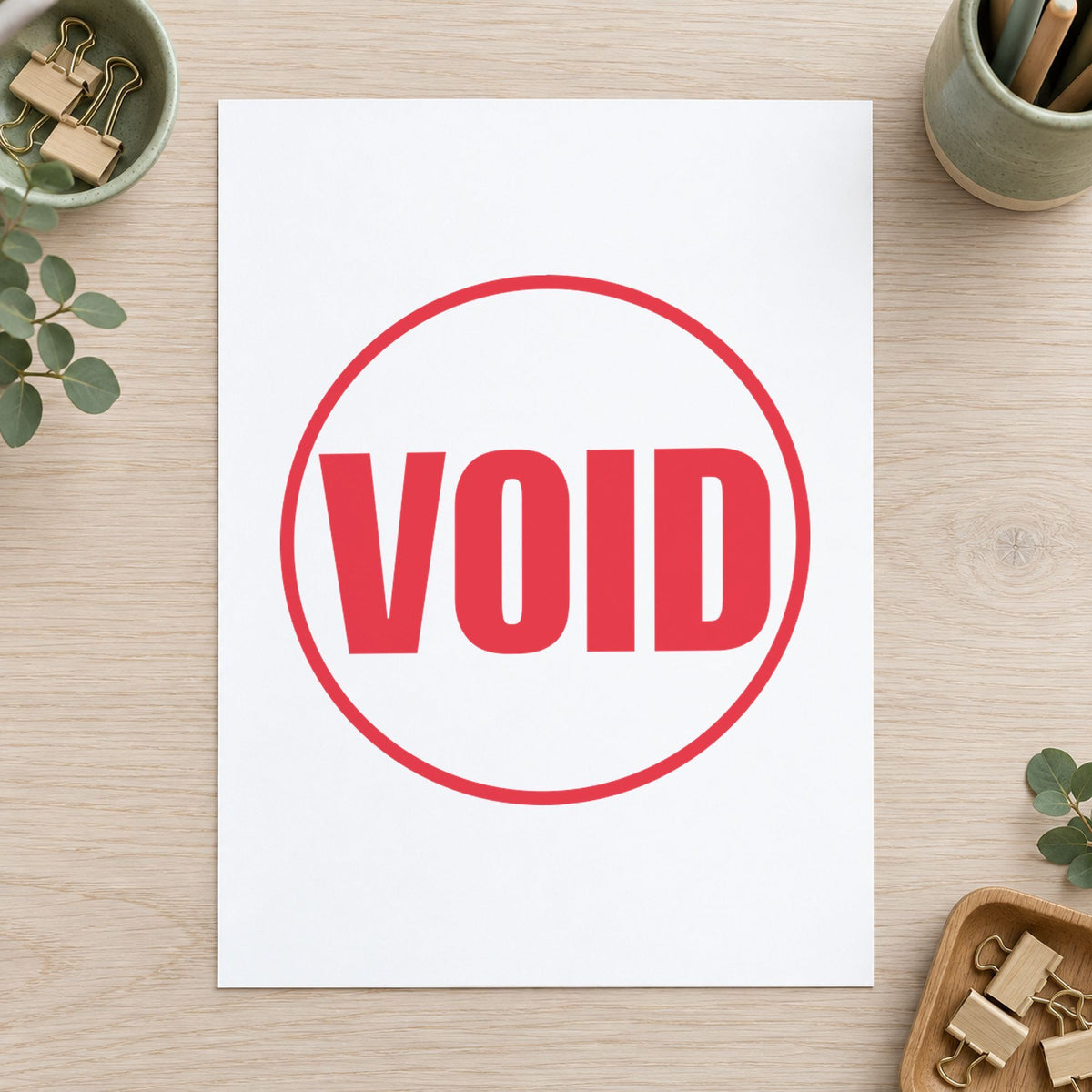 "Void" Xstamper stamp in use on paper, 5/8 inch round imprint