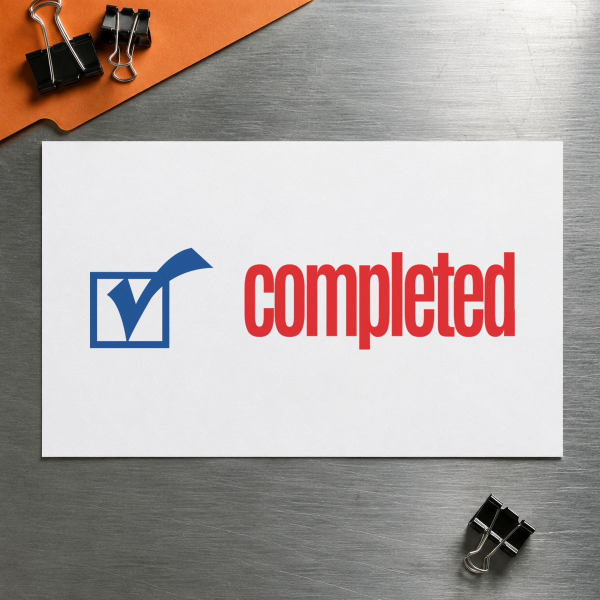 "Completed" Xstamper stamp in use on paper, Approximately 1/2 in tall x 1-5/8 in wide rectangle imprint