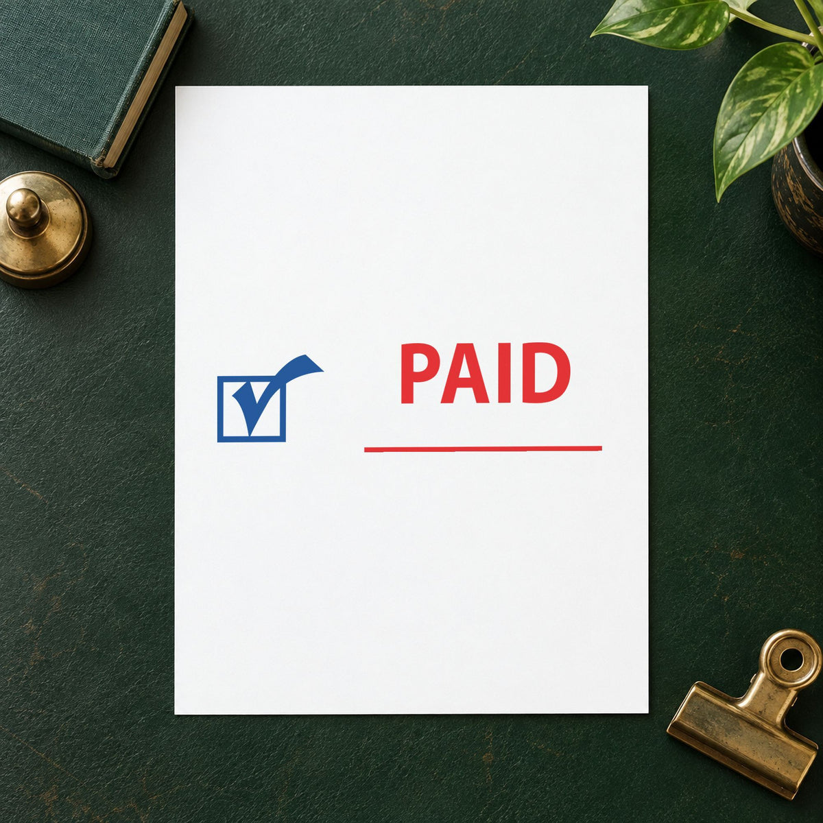 "Paid" Xstamper stamp in use on paper, 1/2 x 1-5/8 in rectangle imprint