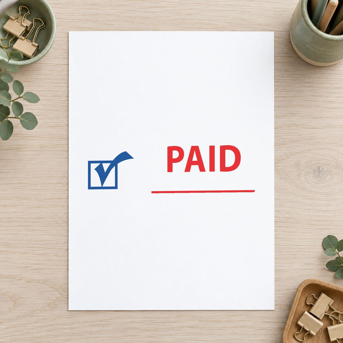 "Paid" stamp pressed on paper, no separate ink pad needed