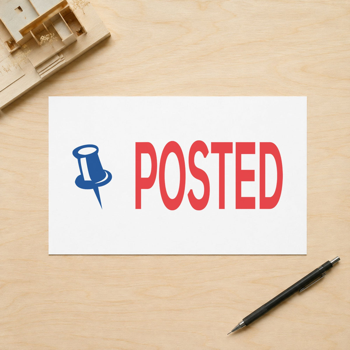 "Posted" Xstamper pre-inked stamp beside its rectangle imprint