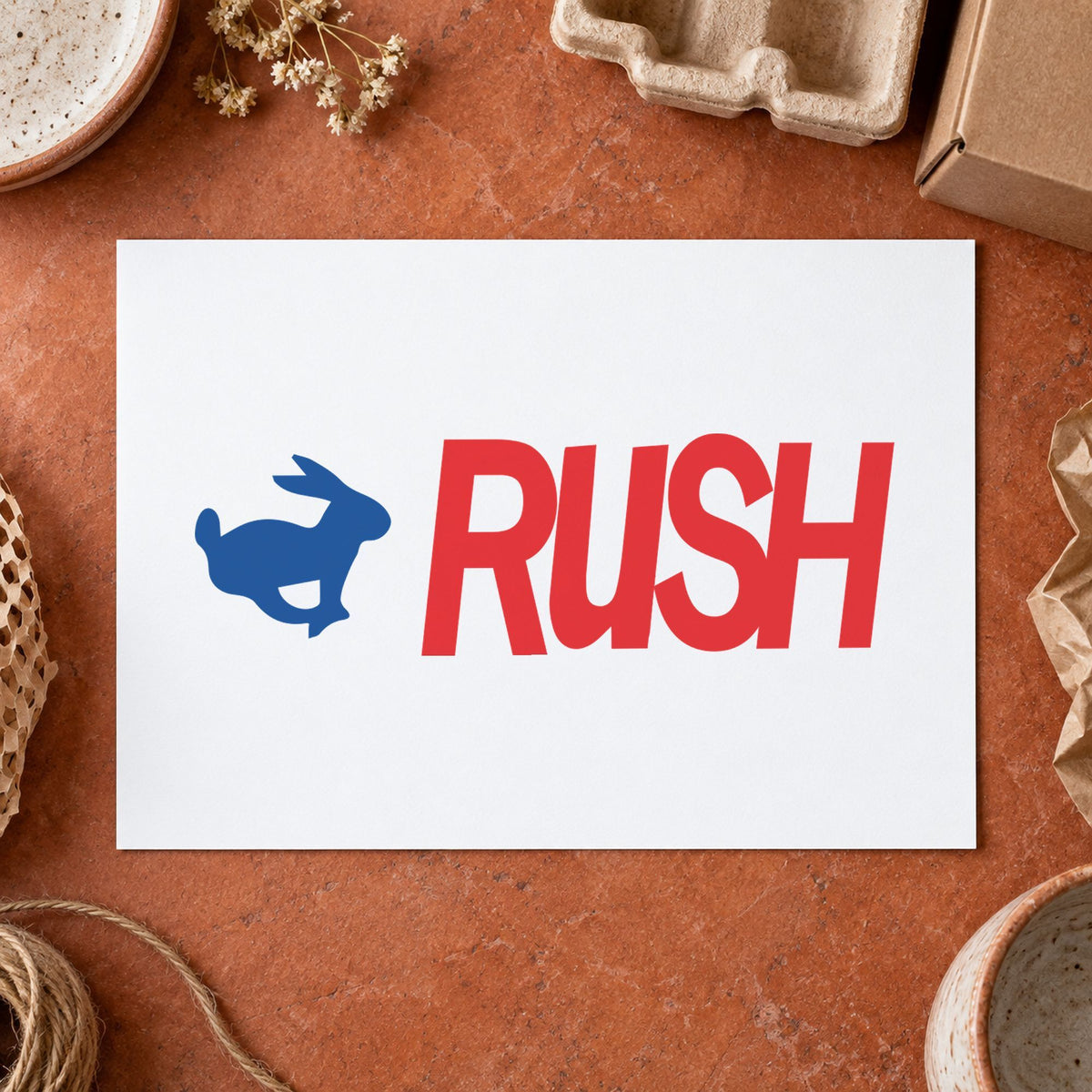 Pre-inked "Rush" stamp marking paperwork in an office setting
