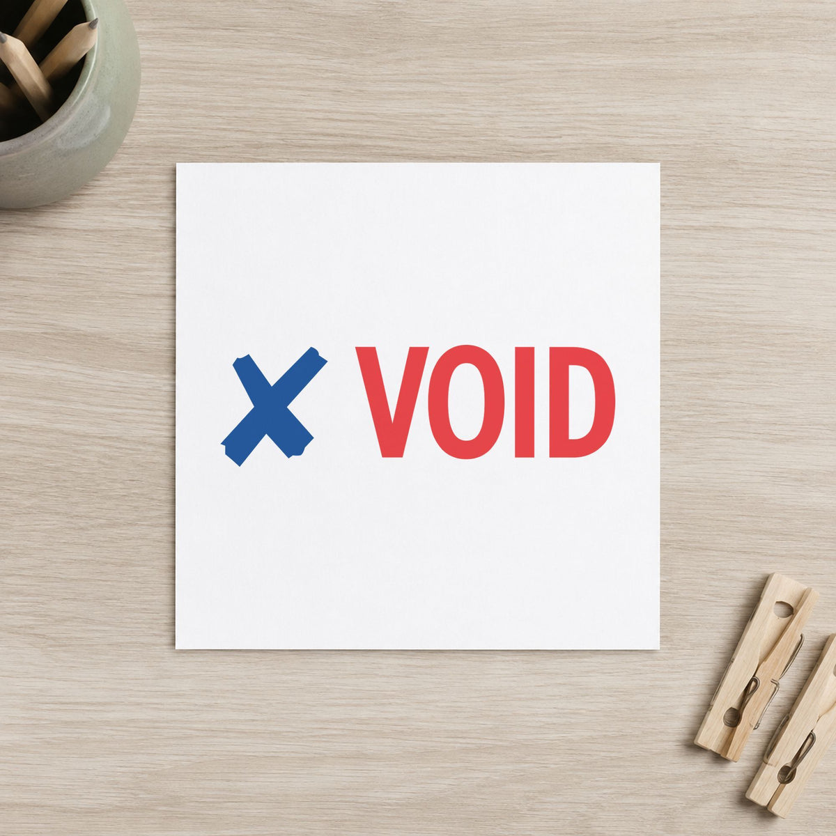 "Void" Xstamper pre-inked stamp beside its rectangle imprint