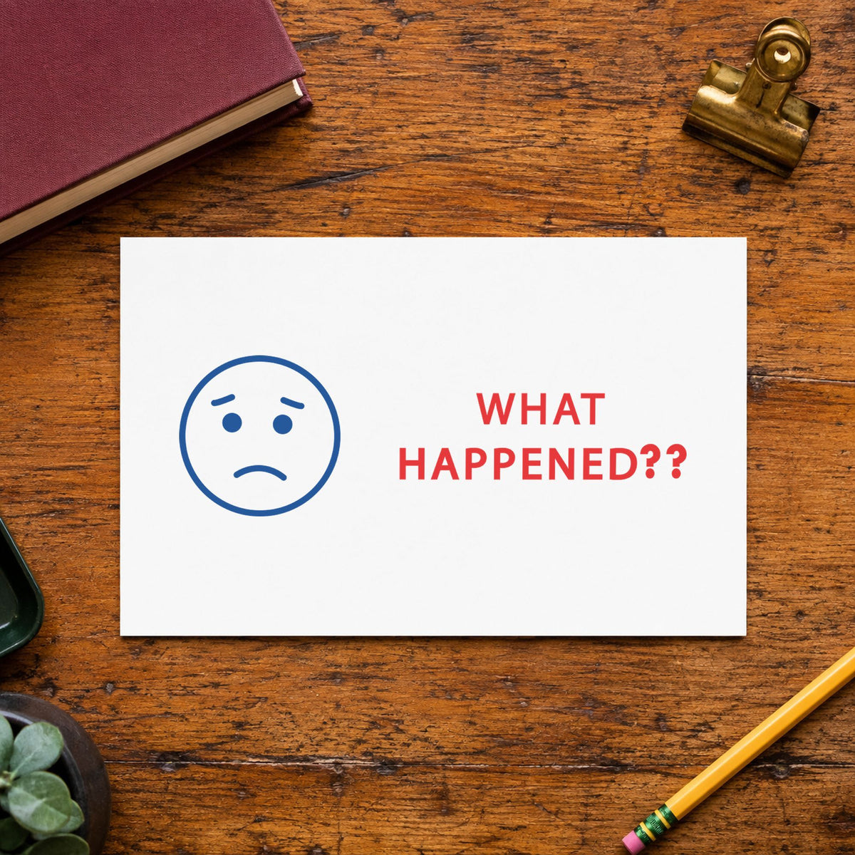 "What happened?" Xstamper stamp in use on paper, 1/2 x 1-5/8 in rectangle imprint