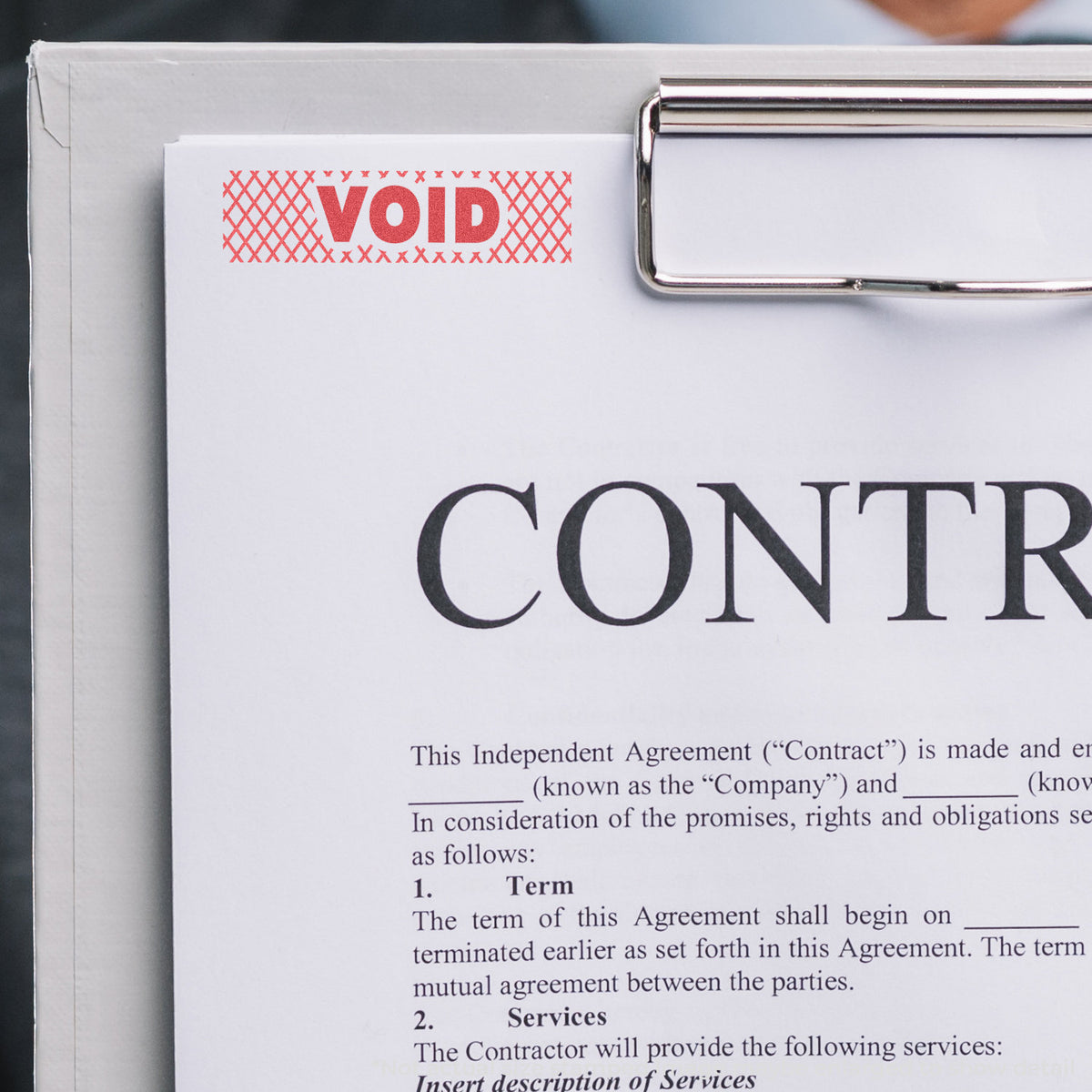 "Void" pre-inked imprint on a page, rectangle shape at 1/2 x 1-5/8 in