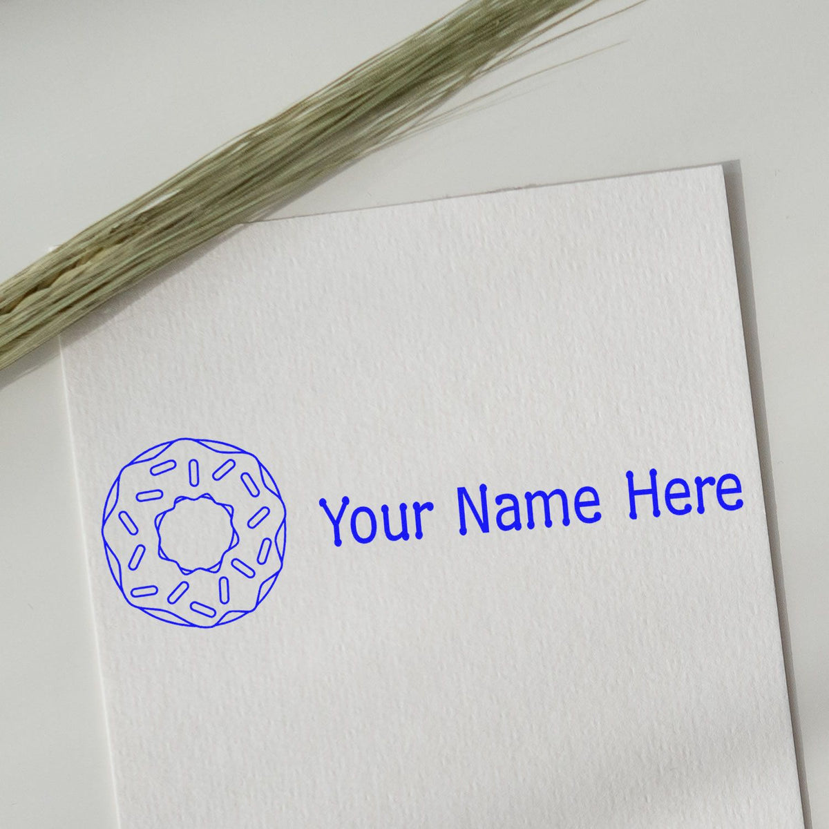 Blue custom stamp and seal design with circular logo and Your Name Here on white textured card