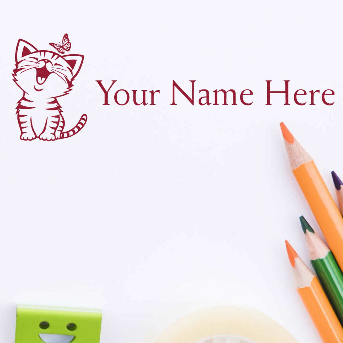 Red custom stamp seal with smiling cat, butterfly, and Your Name Here on white paper